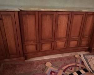 Marble-top extra long retractable TV cabinet.