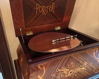 Antique Porter Music Box with several copper records.