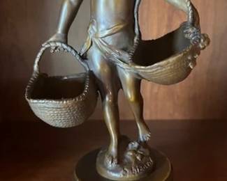 "Girl with Baskets" bronze sculpture by Suzanne Bizard, 11" tall.