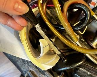 Vintage doctor's bag with stethoscope and otoscope and other instruments