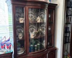 Very pretty dining room set.  Table and chairs, buffet and china cabinet.  It has a set of chicken dishes in it, too!