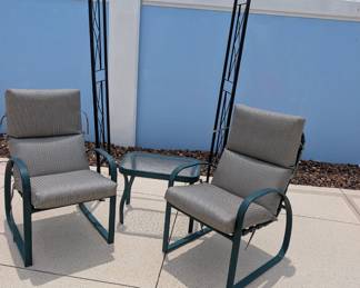 Metal trellis and aluminum patio chairs
