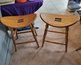 Two beautiful oak bar stools.