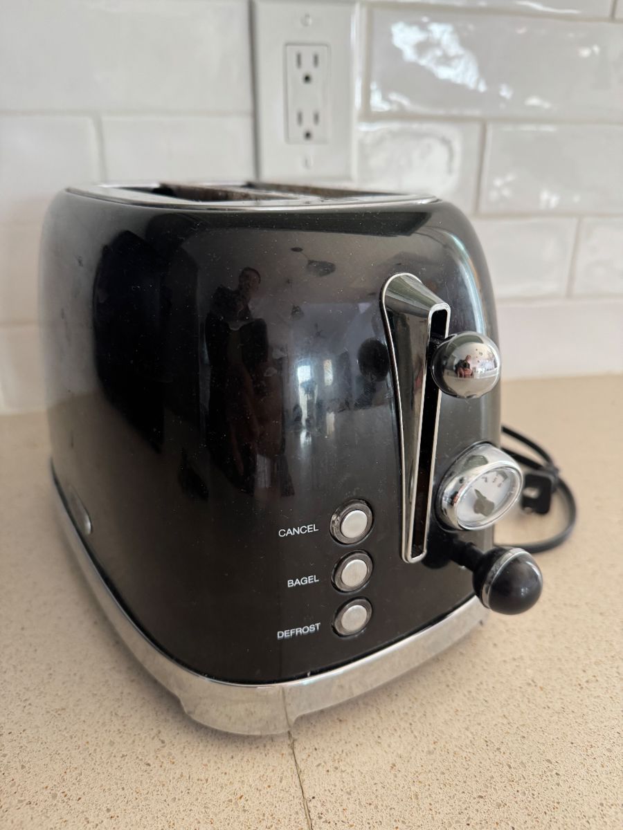 [$25] Add a touch of classic Americana to your kitchen with this authentic 1950s retro toaster! Featuring a sleek black and chrome exterior, rounded edges, and timeless mid-century design, this piece is both functional and decorative ($25)