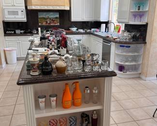 So many glasses! Lots of cordial glasses & snifters, martini glasses, margarita glasses, wine glasses, rocks glasses.