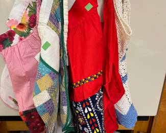 Huge collection of vintage aprons. This is just a few