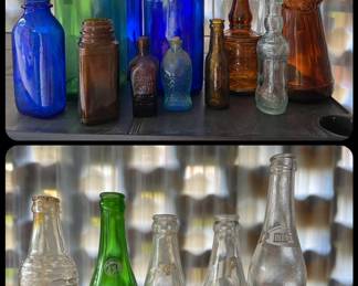 Lots of bottles including some soda bottles