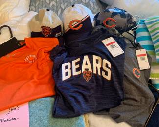 Chicago Bears ball caps, dri-fit shirts with tags attached, zip-up jacket with logo, hat.  