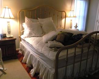 Metal frame king-sized bed.