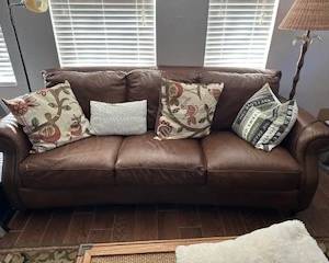 leather sofa with pillows