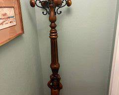 antique coat stand with cherub carving