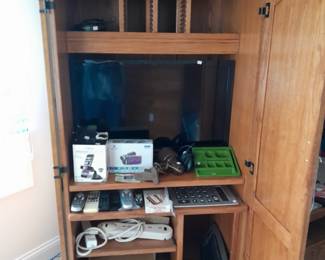 Hutch with electronics, several televisions