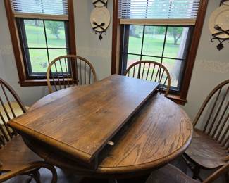 #1 Round Oak Dining Table w/ Leaf and 6 Chairs (2 are Captain Chairs) 41-59x30 (as is finish) $350.00