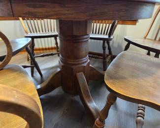 #1 Round Oak Dining Table w/ Leaf and 6 Chairs (2 are Captain Chairs) 41-59x30 (as is finish) $350.00