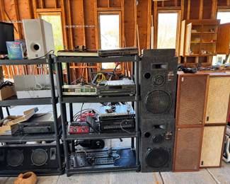 Electronics, turntables, and lots of speakers. 