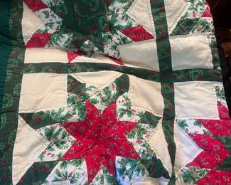 There are about a dozen hand stitched quilts.