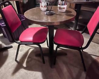 There are six of these pub tables and 12 of the red and black chairs.
