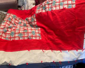 There are about a dozen hand stitched quilts.