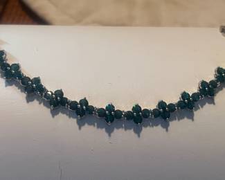Beautiful green clovers make up this bracelet and comes with matching earrings