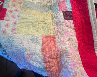 There are about a dozen hand stitched quilts.