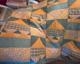 There are about a dozen hand stitched quilts.