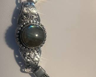 Large tooled sterling silver bracelet with a Lustering Round stone