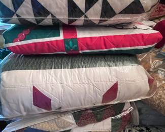 There are about a dozen hand stitched quilts.