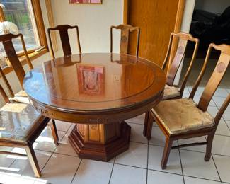 We were asking $500 Monday night price $100 picture 1/2
vintage Chinese made carved Rosewood Round Dining Table
(with octagonal pedestal leg) and six (6) Rosewood Chairs and a glass top cover