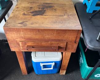 Butcher block cutting table with one drawer.