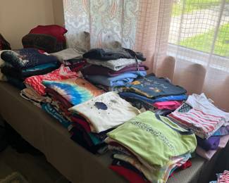 Woman’s small, medium and large blouses and shirts.