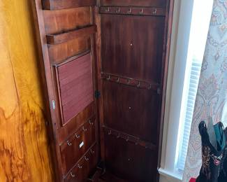 Wall mounted jewelry cabinet.