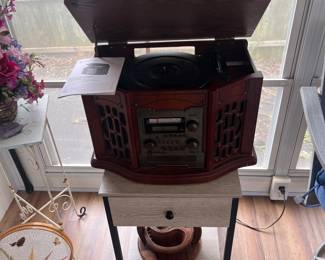 Reproduction vintage working record player/CD/tape player.