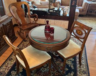 Drum table and matching chairs, vintage rocking chair and carpet.