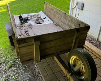 Small Utility Trailer with tow hitch. Wood construction great for hauling yard materials, small tools/equipment or any materials for DIY projects. Has street legal tires.