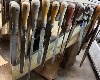Collection of Files used for shaping materials like wood or metal. Various shapes and sizes for different tasks including smoothing, shaping, and removing material.