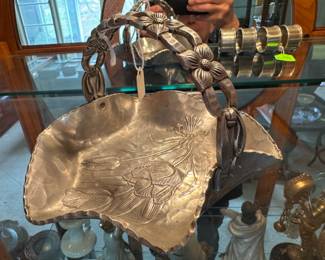 Well-known aluminum craftman's basket creation with flower designed handle and base.