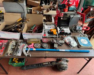 Nice collection of various hand tools, grinders, files, and measuring devices. Leaf Blower also pictured.
