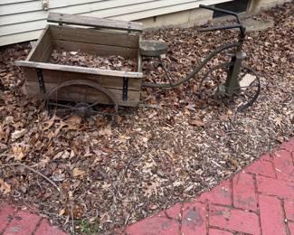Vintage metal and wood tricycle planter. Rare find to enhance your garden space.