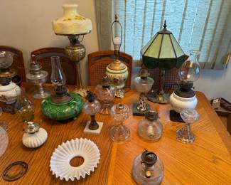 Collection of Vintage Oil Lamps, the primary source of light before electricity. Burns oil drawn up through a wick. Various designs and sizes.