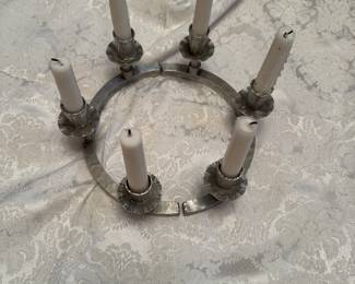 Handcrafted aluminum circle candle holder, beautifully designed. Holds six candles.
