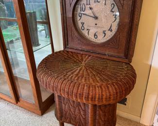 Oval Wicker Table beautifully designed in excellent condition. Also pictured antique carved wooden clock.