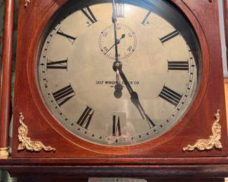 Self Winding Clock Co. Grandfather Clock with ornate features.