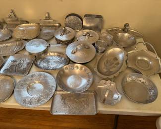 Well-known aluminum craftsman's hammered aluminum serveware. Several sizes, shapes, and designs available. All crafted by hand.