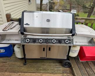 Gas grill with rotisserie motor.