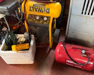4.5 Gallon Dewalt and 5 Gallon Craftsman portable electric air compressors. With hoses and in great condition. Designed for portability and use with pneumatic tools and inflation tasks.