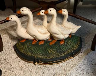 Vintage-style cast iron doorstop featuring geese on a grassy base. A variety of uses for this decorative piece.