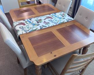Table measures 5.8 (with leaf) long and 44" wide