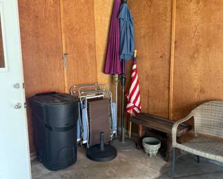 The Garbage Can contains the Earthquake Preparedness Essentials, Folding Lounge Chairs, Umbrellas, Umbrella Stands, USA Flag, Bench