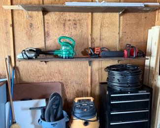 Car vac, Weed Eater, Black and Decker Trimmer, Homelite Chain Saw, Shop Vac, Tomato Cages, Craftsman Tool Cabinet.