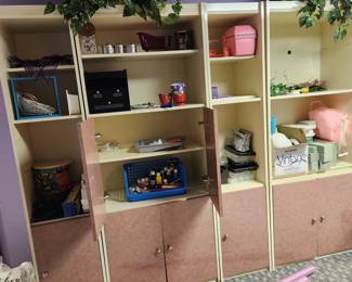 4 piece wall storage unit. Has crafting stuff inside